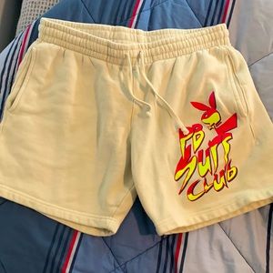 Cream colored playboy surf club shorts